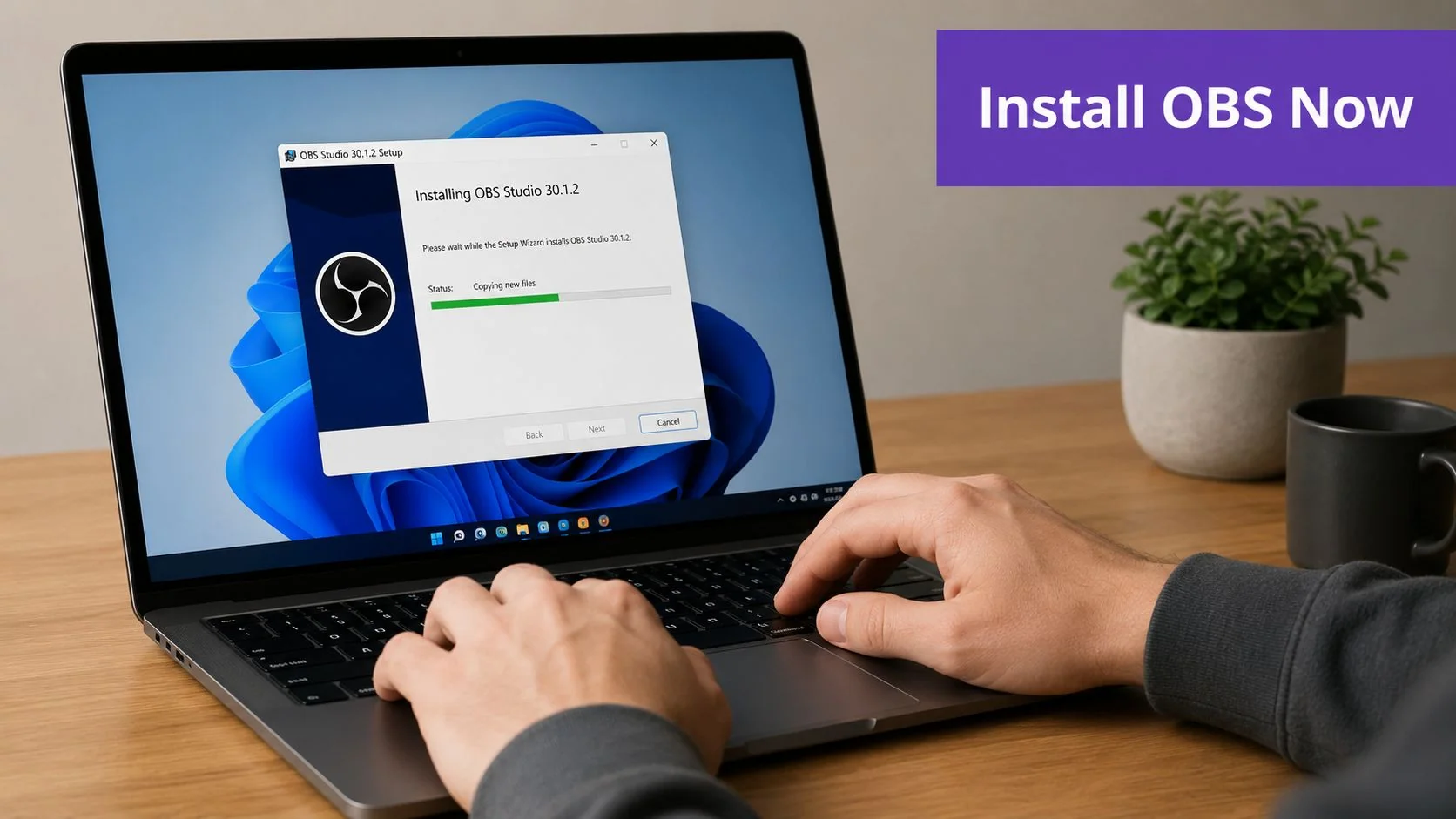 A person using a laptop to install OBS Studio 30.1.2 software on a Windows operating system.